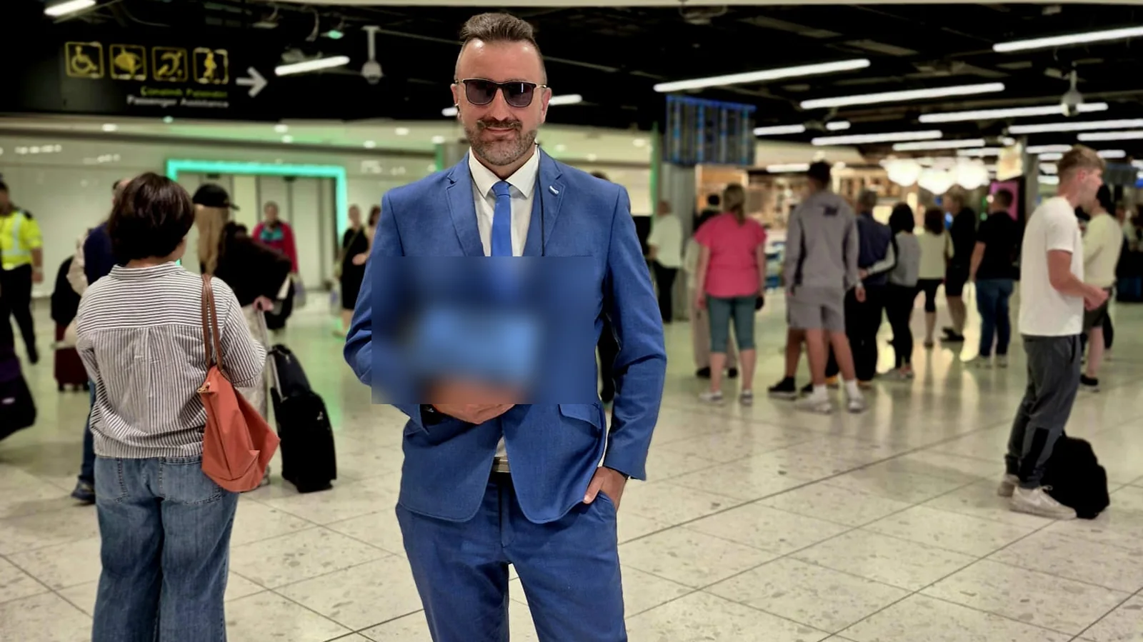 Chauffeur holding a name board in the Dublin Airport arrivals hall