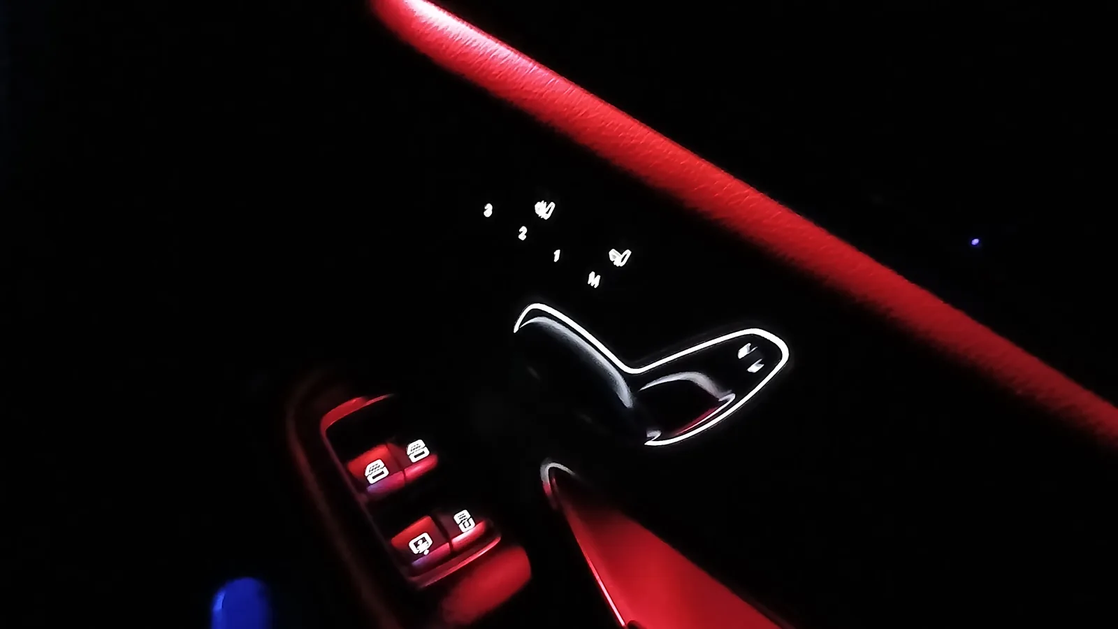 Rear door panel of the Mercedes-Benz S-Class with red ambient lighting