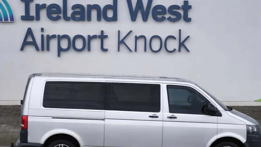 The Sophisticated Travels & Tours Volkswagen Transporter parked at Ireland West Airport Knock, waiting for an arriving private transfer